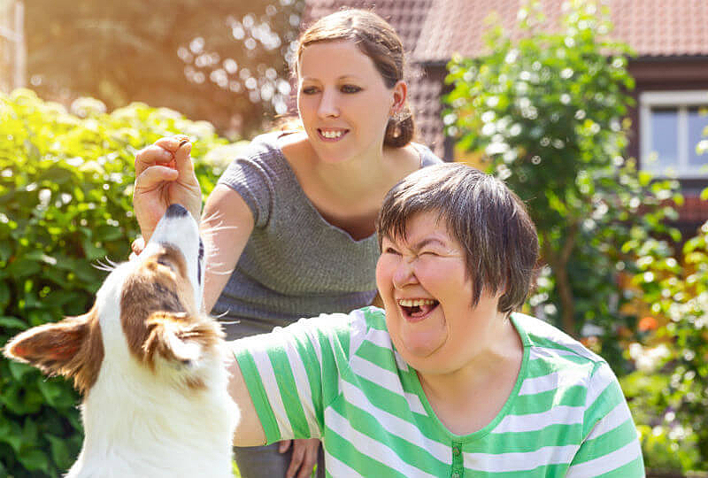 Lady with her carer and dog